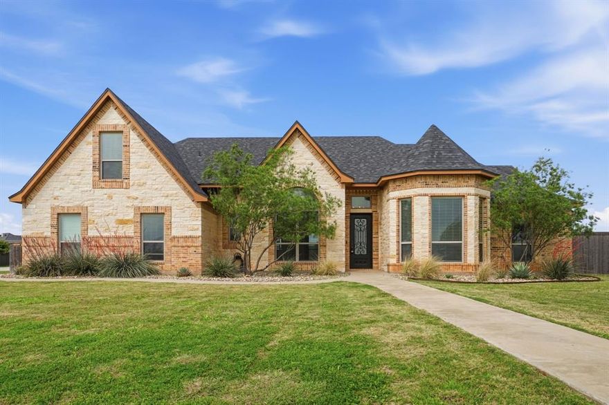 Experience elevated living with exceptional flexibility in this beautifully maintained estate, set on over an acre. Designed with both comfort and sophistication in mind, this home offers expansive spaces for living, entertaining, and everyday ease. The main living area makes a striking impression with soaring ceilings, rich wood beams, and a stunning fireplace that anchors the space with warmth and style. The well-appointed kitchen, complete with double ovens, flows seamlessly into both formal and casual dining areas, perfect for hosting everything from intimate dinners to larger gatherings. The private primary suite, located on the main level, serves as a luxurious retreat. The spa-inspired bath features designer lighting, a jetted soaking tub, a double-entry walk-in shower, and an oversized walk-in closet designed for both beauty and function. Two additional bedrooms share a well-appointed bath, while a third living area offers the ideal space for a refined home office, nursery, or additional lounge. Upstairs, a secluded living area with a private bedroom, full bath, walk-in closet, and separate HVAC system creates a versatile space perfect for guests, multigenerational living, or a quiet retreat. Step outside to an inviting covered patio with a fireplace, extending your living space into the outdoors, ideal for relaxing evenings or effortless entertaining. Outdoors, the covered patio with a fireplace invites year-round enjoyment, extending the home’s living space into a peaceful, open-air setting. The expansive grounds present endless possibilities to design a truly custom outdoor experience. Enjoy the added benefits of no city taxes and no HOA, offering both luxury and freedom in a premier setting.