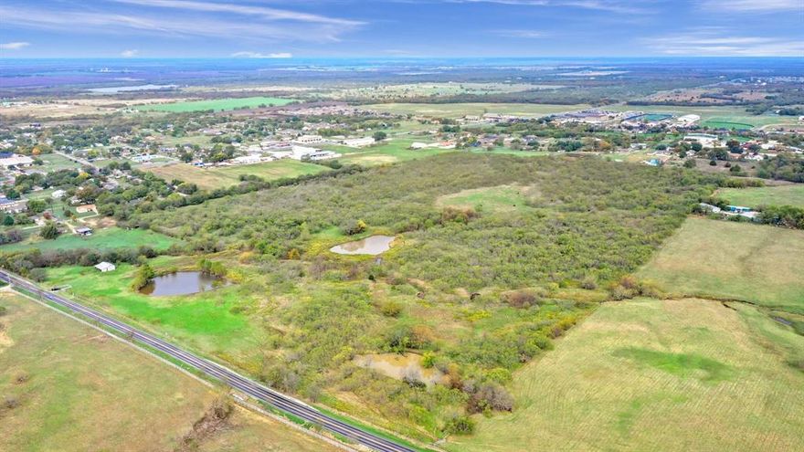 Introducing a prime development opportunity in Gunter, Texas! Presenting TBD E FM 121, a sprawling property with incredible potential. Boasting a convenient location on FM 121, this land is situated in the ETJ with close proximity to the City Limits. With approximately 1300 ft of road frontage on FM 121 and future road access off of Oak St, this property offers excellent visibility and accessibility. Featuring a mix of rolling and level terrain, dotted with lush mature trees, a small creek, and a pond, this land showcases the perfect blend of natural beauty and development possibilities. All utilities are close by, adding convenience to your future development. Gunter offers a thriving community and a highly regarded Gunter ISD, making it an ideal location for residential or commercial projects.  Don't miss this incredible opportunity. Contact us now to explore the endless possibilities that TBD E FM 121 has to offer.