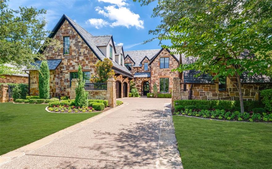 GOLF MEMBERSHIP available for buyer to purchase upon closing, subject to club approval. Nestled in the prestigious, guard-gated Vaquero neighborhood of Westlake, this 2018 custom-built home offers luxury, thoughtful design, and tranquil greenbelt views. Designed for entertaining, this two-story residence features an open floor plan with a living room anchored by a limestone fireplace and panoramic views of the pool and landscaped yard. The chef’s kitchen opens seamlessly to the living area and includes Taj Mahal quartzite countertops, Sub-Zero refrigerator & freezer, Wolf range, and Miele dishwasher. A separate prep kitchen features a second sink, Miele coffee maker, Wolf warming drawer, Sub-Zero beverage fridge, and generous storage. The breakfast room is surrounded by walls of glass, while the formal dining room sits off the entry, adjacent to a refrigerated wine room and wet bar with ice maker. The first floor includes both a spacious primary suite and private guest suite for convenience and privacy. The primary suite is a serene retreat with floor-to-ceiling windows, blackout shades, and peaceful views. A private study completes the main level. Upstairs offers a secondary living room, an air-conditioned flex storage space, and a craft room. Two additional guest suites each feature en-suite baths. A home elevator ensures easy access between floors. Smart home automation manages lighting, AV, and electronics throughout. The backyard oasis boasts a sparkling pool, covered seating areas, fireplace, grilling station, and low-maintenance turf—all overlooking a greenbelt. Three-car garage with epoxy floors and built-in storage plus a separate golf cart garage. Zoned for Westlake Academy and eligible for Southlake Carroll ISD through open enrollment.