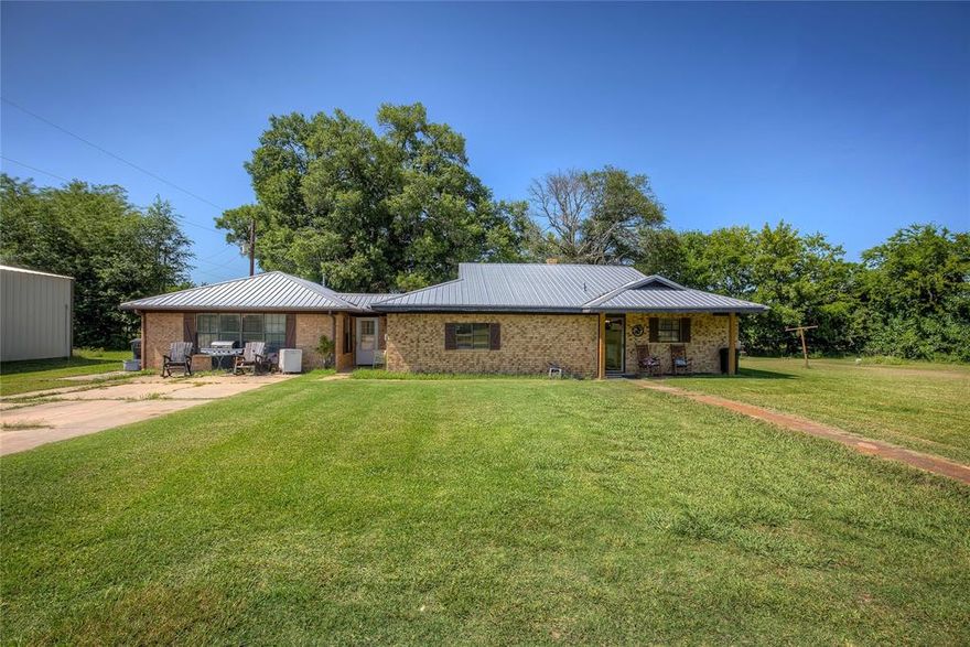 **Motivated Seller** Take a look at this conveniently located property in the small town, big heart of Cooper, TX. Only 5 mins away from Cooper Lake State Park! Upon entering the property, you will find a ranch-style brick home situated on 2 acres with fully functioning separate entry quarters and a 30x40 workshop with electricity. The main house features an eat-in kitchen with an open concept to the 17x19 living area. The master bedroom features a master bath, sliding barn doors, and a spacious walk-in closet. The second bedroom is large and also features a walk-in closet. The hall bath features a large vanity area with a walk-in shower. Extra room located off the main living area could be converted into a third bedroom, office space, or sunroom. This property has multi-use possibilities. Can be utilized as two separate fully functioning houses, large gatherings, MIL quarters, or a separate apartment rental. Selling AS IS.