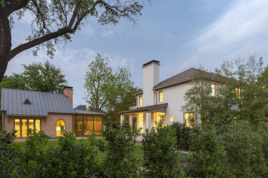 In the pantheon of Dallas real estate, few residences command the presence of this West Highland Park masterwork. Situated on a rare, sprawling double lot, this estate has been reimagined through a meticulous, design forward renovation that transcends the ordinary. Curated in a brilliant collaboration with renowned designer Brant McFarlain and lighting visionary Shane Douglas, the home is a sanctuary that is as much a piece of art as it is a residence.

The interior is a study in tactile luxury. Smooth finish walls serve as a gallery like backdrop for custom millwork and layered ceiling treatments, from the ethereal plaster moldings to the wood paneled ceilings. The culinary heart of the home is a triumph of form and function, anchored by SubZero and Wolf appliances and bespoke cabinetry. For the consummate host, the home offers a sequence of entertaining vignettes, including a custom wet bar with a dramatic elliptical ceiling and stone shelving.

The primary suite is a masterclass in quiet opulence, anchored by a fireplace with a custom marble surround. Throughout the home, the devotion to quality is absolute, featuring full marble walls from Artistic Tile, Waterworks fixtures, and a powder bath that rivals a high fashion boutique. Even the most practical elements are elevated, from Lutron HomeWorks automation to a discreet, custom built dog suite.

The exterior is a sprawling paradise of leisure, centered around a massive outdoor living pavilion that overlooks the lush, oversized grounds. The crowning jewel is the 2024 custom built multi use backhouse a soaring, flexible space that serves as a high end gym, executive office, or guest retreat. Complete with a 22 foot screened porch, full bath, kitchenette, and fireplace, this structure epitomizes the more is more philosophy of West Highland Park luxury. This is the definitive statement of Dallas elegance, where scale, craftsmanship, and livability come together seamlessly.