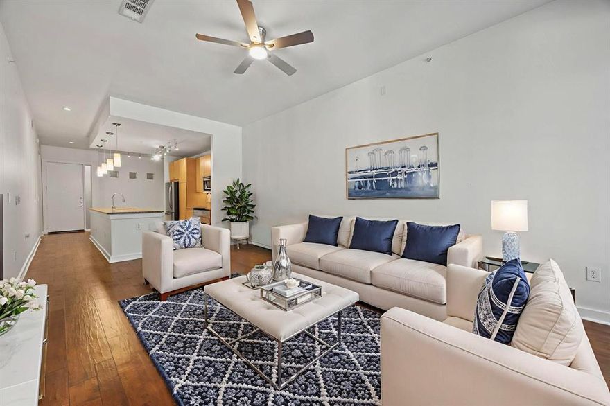 Live in the heart of it all with this stylish and modern condo located in one of Dallas’ most walkable neighborhoods—a Walk Score of 96! Just steps to Starbucks, Whole Foods, popular restaurants, vibrant nightlife, and boutique fitness studios, this home offers an unbeatable urban lifestyle. Plus, it’s located within a Public Improvement District (PID), enhancing community services and improved infrastructure.

Step into one of the larger one-bedroom floor plans in the community, featuring a spacious and modern open-concept layout. Soaring 10-foot ceilings and floor-to-ceiling windows flood the interior with natural light. Freshly painted in 2025, the main living area is finished with sleek vinyl plank flooring, while the bedroom and walk-in closet feature brand-new carpet. Stylish ceiling fans in both the living room and bedroom enhance comfort with a contemporary touch. HVAC is 2017.

The kitchen is thoughtfully designed with granite countertops, a spacious island, stainless steel refrigerator, and abundant storage. The adjacent dining area can easily double as a home office.

The large primary bedroom includes an ensuite bath with a spa-style tub and walk-in closet. A convenient half-bath is located at the front of the condo for guests. Both bathrooms are finished with classic ceramic tile flooring.
You'll also enjoy a full-size washer and dryer and extra hallway storage. Step out onto the private patio with leafy views overlooking McKinney Avenue—offering privacy in an urban setting. Two assigned tandem parking spots (#8 and #9) are just steps from your door.

Community features include secure gated access, a second-floor pool and lounge area, and an onsite manager to welcome guests and accept packages.
This is modern city living with comfort, convenience, and a location that can’t be beat!