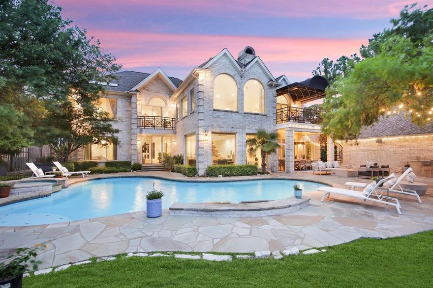 Steeped in unrivaled privacy and serenity, this stunning Colleyville home with CASITA flaunts dramatic views and luxurious finishes. Beautiful lakefront setting will make you feel like you’re on vacation every day. Poised on a sprawling 2.6-acre parcel, this oasis boasts upscale features including designer accents, massive windows, smooth walls, wine room, and 5” white oak floors. The culinary epicenter of this home boasts a chef’s kitchen adorned with top-tier appliances and dual expansive islands. A peaceful retreat unfolds in the primary suite presenting lake views, a vaulted ceiling, a spa-like bath with a soaking tub and dual vanities, private sitting room and balcony. With 5 generously appointed bedrooms and remodeled bathrooms, luxury and comfort abound. A detached casita awaits with its own kitchenette and awe-inspiring views. This premier location in the sought after Colleyville school district is close to Dallas, Ft. Worth and DFW Airport - seize the opportunity today!