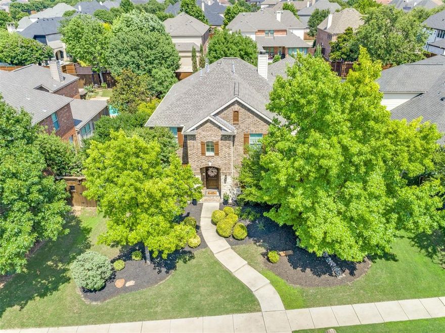 Move In and Smell the Roses this Spring! Room to Grow, Smart to Own, Designed to Impress. Located in Frisco’s coveted Northridge community, 12744 Concho Drive boasts 5-bedroom, 3-full bathroom, situated on a desirable oversized lot. Offering over 3,700 square feet of versatile living, perfect for growing households, multi-gen families, or anyone who needs room to live, work, and entertain with ease. Downstairs, you’ll find warm engineered wood floors, soaring ceilings, and a layout that balances open-concept living with defined spaces. The kitchen is a true gathering spot with granite counters, a tumbled marble backsplash, upgraded cabinetry with pull-out drawers, and an island that flows right into the breakfast nook and living room. A full guest suite on the main level makes hosting easy, while the formal dining room and formal living space offer flexibility in your desired use. Upstairs, offers 3 nice sized bedrooms, hall bath that was recently remodeled to offer a walk-in spa like shower. You can not miss the large game room,provides a second hangout space, custom built-ins on the hallway to your own movie theater. Movie lovers will appreciate the dedicated media room, complete with screen, projector, and oversized leather stadium style seating that will convey. The oversized primary suite is tucked away for privacy and includes tall ceilings, dual vanities, a glass-enclosed shower with a bench seat, and a large walk-in closet. Step outside to enjoy a lush large yard with a large pergola-covered patio, board-on-board fencing, and landscaping, plenty of room for entertaining or play. Tech-savvy buyers will love the smart home features like remote-access locks, thermostat, garage control, and security. A tankless water heater, whole-home filtration, and recent roof in 2022, gives added peace of mind. Zoned to highly rated Frisco ISD schools, just blocks from the community pool and Boals Elementary, this home is also minutes from the PGA, dining, and shopping.