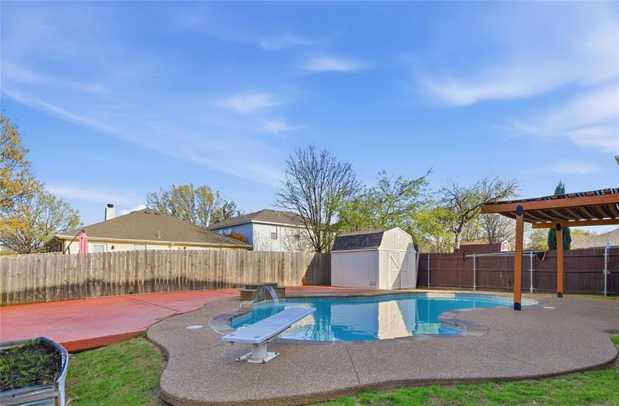 THE LOWEST-PRICED POOL HOME IN THE 76262 ZIP CODE! Zoned for top-rated Byron Nelson High School! Recent upgrades shine throughout, including fresh interior paint (2026), plush new carpet (2026), and stylish luxury vinyl plank flooring. Imagine a lifestyle where your weekends are defined by poolside relaxation and effortless entertaining in your own private oasis. Situated on a spacious corner lot in a quiet neighborhood with no HOA, this beautifully updated home offers the perfect blend of modern comfort and suburban freedom. The pristine kitchen is a chef’s dream, featuring sleek granite countertops, a functional center island, a walk-in pantry, and an included refrigerator. Retreat to the oversized primary suite showcasing a soaking tub, separate shower, and a vanity featuring a dedicated makeup station. Every bedroom in this home is generously sized and includes its own walk-in closet, ensuring plenty of storage for everyone. Upstairs, the massive game room provides a versatile second living area for movie nights or play. Step outside to the ultimate entertainment hub: a sparkling pool with a soothing waterfall, a large deck perfect for summer cookouts, and a huge backyard with a convenient storage shed. Peace of mind comes standard with a recently replaced roof. Great location within walking distance to Lost Spurs Park and schools, with quick access to 35W and 170 for a seamless commute. Take a first-person look at this gorgeous home! Click the Virtual Tour link to see the 3D Tour!