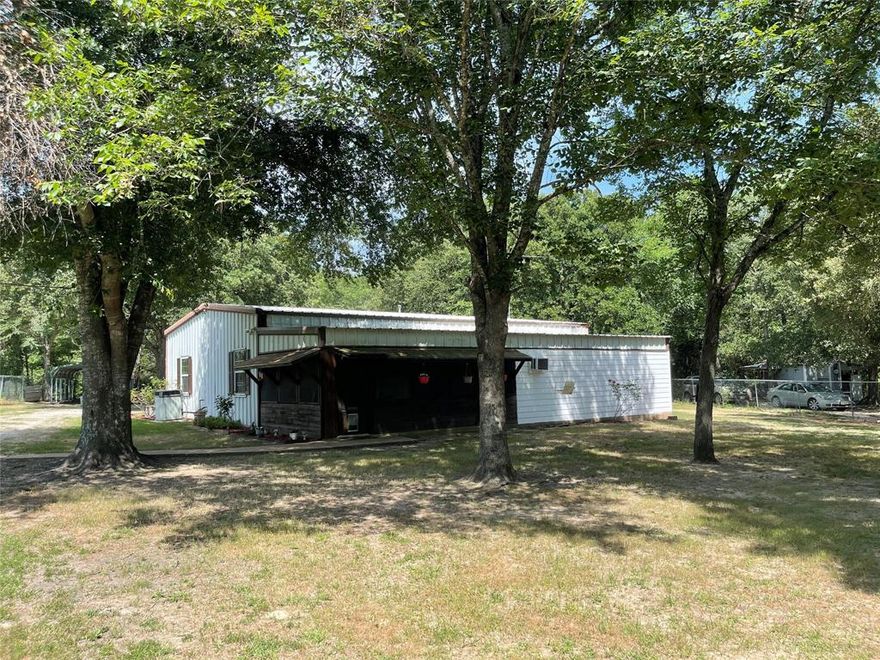 Looking for a place in the Richland Chambers Lake area that's well cared for, spacious yet cozy, lots of gorgeous trees and awesome screened porch for outdoor relaxing?  It's right HERE! This 2 bedroom, one bath home also offers a study AND a room off the porch that would make a great crafting room, exercise area or just a good old fashioned man cave. The home features an island kitchen with the refrigerator and deep freeze being included and a spacious breakfast room.  Rustic notes of wood and corrugated metal give the home a relaxed, country feel. The laundry room off the back of the home has space for a full size washer & dryer, shelving and table workspace. The property also offers a detached 2 car garage with space for a potential workshop & a small covered porch perfect for fish cleaning, a single carport, fenced perimeter and a fire pit! With metal construction and metal roof, this home is a grass-roots barndo. New heat & ac 06-2023. New water heater 2024. See this one!!