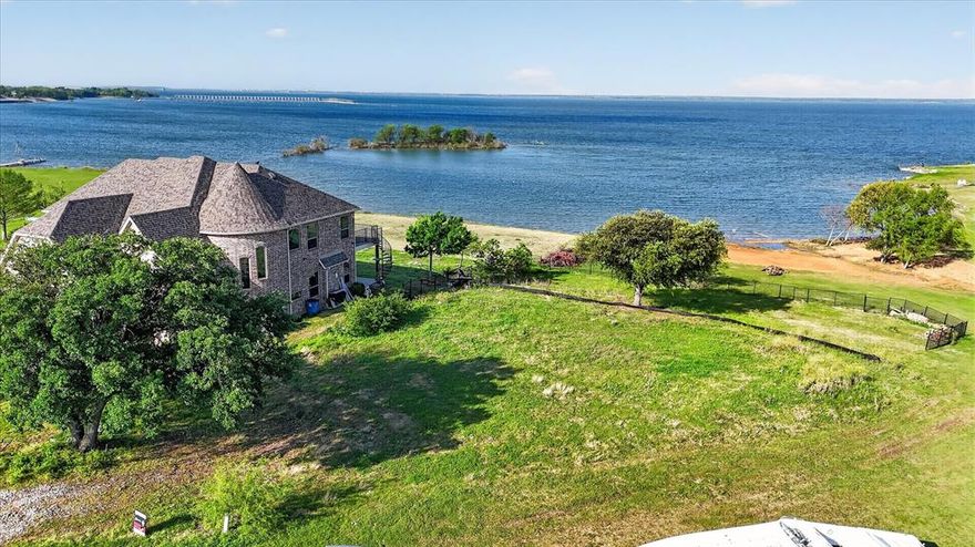 This is a scarce waterfront lot in FRISCO with an unobstructed lake view that stretches as far as the eye can see. Imagine waking up to the gentle sounds of nature, where the chirping of birds and the soft lapping of water replace the city's noise, creating a tranquil retreat from the rush of everyday life. In the early morning, golden sunlight dances on the lake's surface, casting a warm, peaceful glow over the entire landscape. Such a unique and coveted location is truly one of a kind, and once it’s gone, it’s gone for good. Whether you envision building your dream lakeside sanctuary or making a wise investment, this lot is the perfect choice.