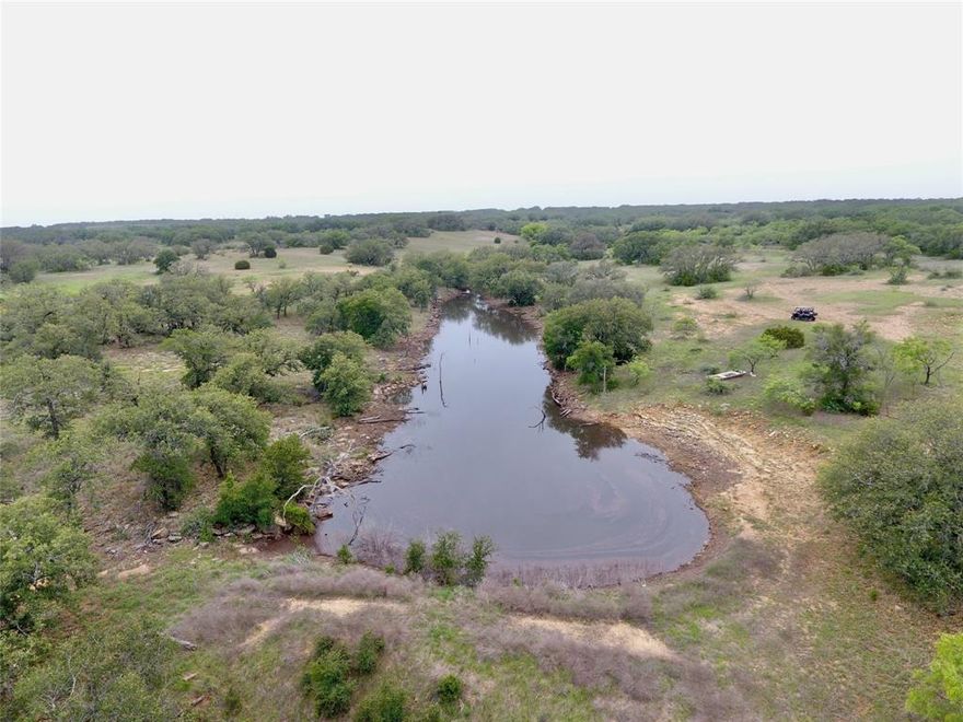 Unique ranch property that offers great hunting, grazing and recreational opportunities! Terrain is a unique blend of open field for food plots or crops, rolling hills with a tree mix including live oaks, post oaks, browse with some mesquite and cedar. 4 water wells with condition unknown on 2 of the wells. Three stock tanks that all have water thanks to recent rains. Wet weather creek feeds two of the tanks. Fully fenced with one cross fence. Deer stands and feeders can convey. Barndo is 4 bedroom, 3 bath with covered porch. Interior features include granite counter tops, beautiful knotty alder kitchen cabinets, stained concrete floors downstairs with hickory hard wood floors upstairs bed rooms. Beautiful property so call today and schedule a time to take a tour!