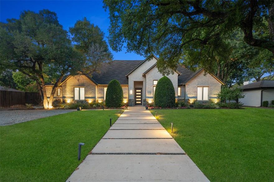 Striking one and one-half level brick with stone transitional, boasting four en suite bedrooms, study and two living areas down, and two bedrooms with gameroom up. Built in 2016 on a treed one-third acre, with a sparkling pool, spa and large grass area off of the outdoor living area complete with fireplace and custom bar-b-que area. This home has October 2024 updates including fresh paint and refinished wood floors. An open kitchen is the heart of this home featuring granite counters and lighted cabinets with double ovens, gas cooktop and built-in refrigerator. Take comfort in knowing there is a whole-home generator to power through any loss of electricity, in addition to foam encapsulated insulation with zoned HVAC. Three-car rear entry garage with spacious gravel parking in the front. Close to Dallas private school corridor, parks, Northaven Trail and shopping, this home is move-in ready for new owners.