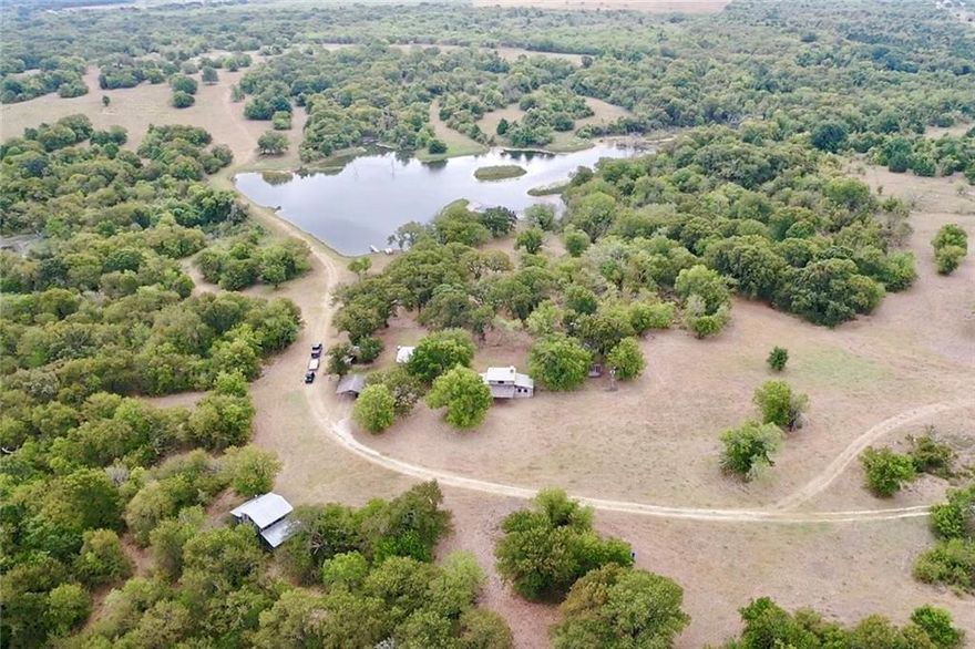 JUST IN TIME FOR HUNTING SEASON-964 Acre ranch near Dallas. This is a Rare find only 1 hour from Dallas.This historic ranch offers incredible hunting camp featuring restored 1860's cabins and replica cabins nestled near a large lake. There are 4 cabins with sleeping quarters, indoor plumbing in all cabins, cook shack, wood burning sauna,wood burning hot tub (Swedish designs) and barns for storing equipment. Property is good cattle ranch and has loads of deer, wild hogs & duck.Several feeders and blinds are strategically located for hunting,plenty of food plots, several fields for planting wheat, or hay crops.Approx.50% heavy timber with huge oaks,pecan trees providing great cover for wildlife.40' lookout tower.