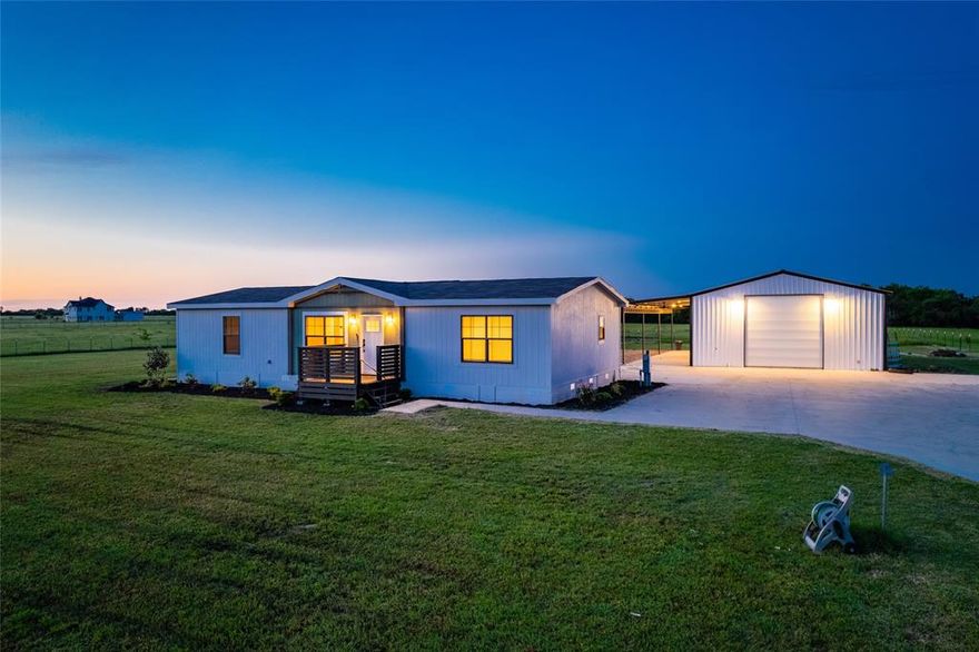 Tucked away on a quiet country road, this 6.21-acre slice of East Texas paradise is more than just land—it’s a lifestyle. Imagine waking up each morning to the sound of songbirds and the sight of sun-drenched pastures stretching beyond your windows. At the heart of the land sits a spacious 2022 double-wide manufactured home, featuring 3 bedrooms and 2 bathrooms, thoughtfully laid out for both everyday living and weekend entertaining. The 30x50 workshop is a standout feature—perfect for working on projects, storing equipment, or even converting into a creative studio or business space. Whether you're raising animals, starting a hobby farm, or simply enjoying the wide-open space, the fenced pastureland is ready for whatever plans you have in mind. Located just minutes from the small-town charm of Wills Point and within easy reach of Dallas, this property combines convenience with the peace and privacy of country living. *Additional acreage available for purchase*