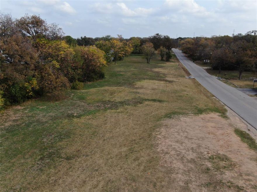 exceptional opportunity in a prime Haltom City location. This centrally located .77-acre parcel offers outstanding flexibility for a wide variety of commercial uses. With easy access to major thoroughfares and excellent visibility and stunning views of a pond. The property benefits from a treed perimeter providing natural privacy along the boundary lines. Utilities are easily accessible, and there are no known land restrictions, giving future owners freedom and versatility in design and purpose.With endless possibilities and strong area growth, this tract is a rare chance to secure valuable commercial land in one of Haltom City’s most convenient locations. Perfect for investors, developers, and business owners looking to build in a high-demand corridor.