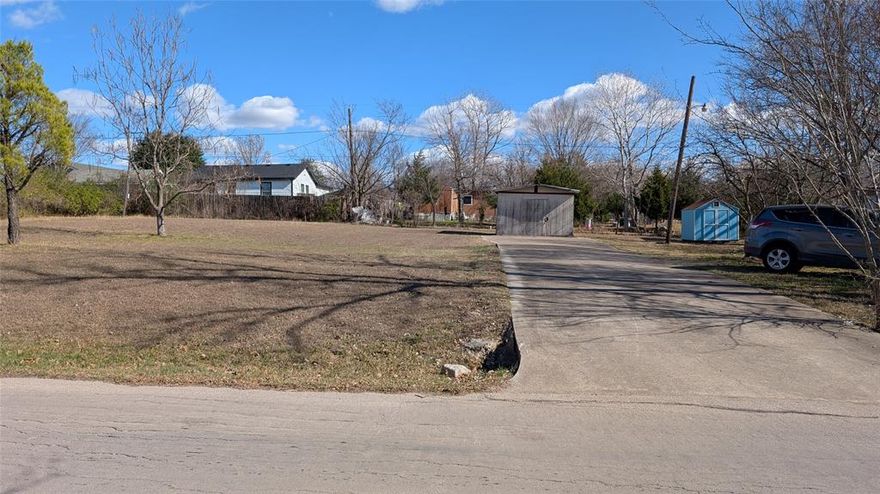 NO HOA!  Close to I-30 and the lake. City water and sewer is available, no septic needed.  Rockwall schools, abundant shopping and dinning close by.  Perfect lot to build on (city of Rockwall restricts mobile homes), already has concrete culvert and drive plus a storage shed.