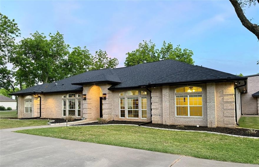 Located in the original section of Pecan Plantation Airpark (FAA identifier 0TX1), this well-designed single-story home offers 2,992 sq ft with 3 bedrooms, 3 baths, 2 living areas, 2 dining areas, and a versatile bonus room that could serve as a 4th bedroom. Built in 2002 on 1.46 landscaped acres with several mature pecan trees, the functional floorplan provides generous living and entertaining space, complemented by a large screened patio. Energy-efficient geothermal HVAC adds long-term value. Concrete taxiway access and close proximity to the runway enhance convenience. The impressive 4,000 sq ft hangar features a 68x14 Higher Power door, 18x14 overhead door, and a 28x15 climate-controlled workshop office. Enjoy all the amenities of Pecan Plantation, including 17 miles of Brazos River with three private beaches, a private marina with access to Lake Granbury, golf, clubhouse dining, pools, tennis, parks, shopping, and on-site medical facilities—offering a true fly-in lifestyle within a full-service gated community.