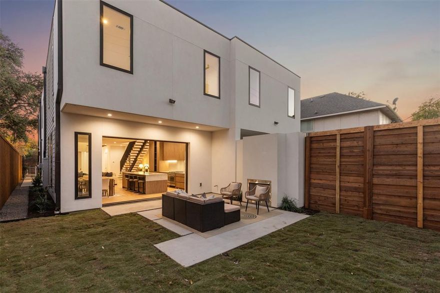 Stunning new construction duplex located in an unparalleled M-Streets location. This home offers the perfect blend of urban living and modern design, boasting an open and airy floor plan that maximizes natural light and expansive space. Upon entering, you'll be greeted by a floating metal staircase, a chic fireplace and mantel, and 7 skylights, all setting the tone for the home's contemporary elegance. The kitchen is a show stopper, featuring a striking waterfall island, custom cabinetry, panel front refrigerator and dishwasher, and under cabinet lighting. The downstairs office, which can be quietly closed off with its unique door system, fulfills all work-from-home needs. The primary bedroom is a tranquil retreat, complete with a en-suite bathroom with a walk-in shower, separate soaking tub, and a custom closet with ample space. The seamless indoor-outdoor flow is highlighted by a three-panel hidden door system, creating a seamless transition to the private landscaped backyard. Here, you'll find a cozy fireplace and a spacious patio, perfect for entertaining or enjoying a quiet evening under the stars. The 2 car garage is seamlessly built into the front facade. Zoned to Mockingbird Elementary and walkable to all of the fun and retail that Greenville offers.