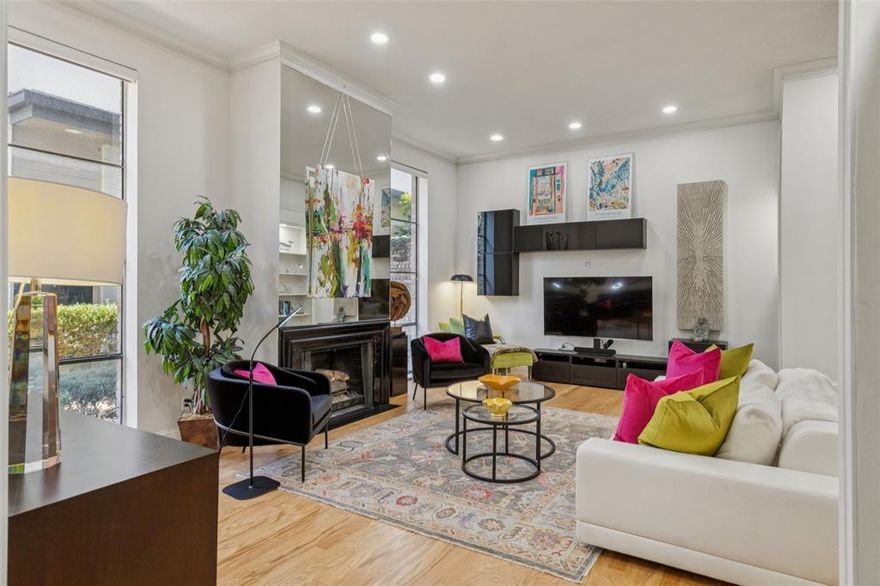 Set in a boutique building in one of Dallas’ most coveted neighborhoods, this front-corner, two-story residence blends timeless mid-century style with modern comfort and scale, all in a prime Turtle Creek location just minutes from the city’s best parks, trails, dining, and shopping. Soaring 11-foot ceilings, tall architectural windows, and a gas fireplace define the dramatic living room, creating a space that feels both elevated and inviting. Designed for entertaining and everyday living, the main level also boasts a second seating area, expansive dining room, wet bar, powder bath, and exceptional storage throughout. The kitchen offers generous cabinet and countertop space, stainless steel appliances, and in-unit washer and dryer, all thoughtfully positioned for efficiency and flow. Remote-controlled blinds, built-in shelving, and clean architectural lines reinforce the home’s refined, modern character. Upstairs, two true primary suites provide privacy and flexibility. Both feature walk-in closets and ensuite baths. One suite includes a private seating area with oversized windows, while the second opens to a balcony and showcases an updated bath.  Upgrades including HVAC, roof, wood flooring, and skylights were completed just a few years ago, offering peace of mind and long-term value. Outside your door, enjoy walkable access to Turtle Creek, the Katy Trail, and the vibrant dining and nightlife of Oak Lawn and Uptown, with Knox Street, Highland Park, and Downtown just minutes away. This is a rare opportunity to own a distinctive, design-forward home in the heart of Turtle Creek, where architecture, light, and an unbeatable central location come together beautifully.