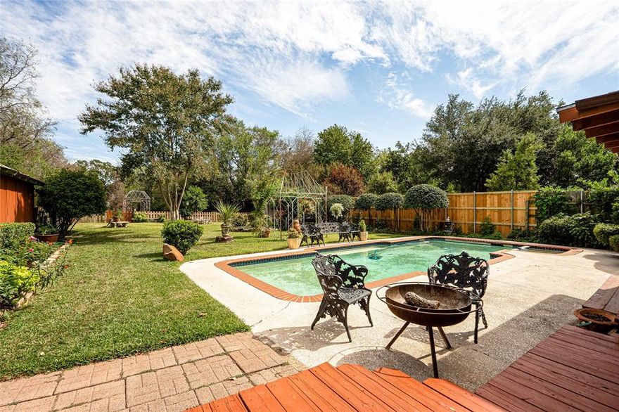 HUGE YARD - Charming home on a beautiful oversized lot with a pool! This unique and well cared for home has 3 bedrooms where the 3rd bedroom is currently being used as a flex space. Once you enter the home, there is an inviting formal dining and sitting
room. The kitchen has SS BOSCH appliances, gas stove, granite countertops, LG Fridge and ample storage. Big windows
with plantation shutters invites the natural light throughout the home. The covered relaxing and private back porch has and
views of the pool and garden. A must see home!