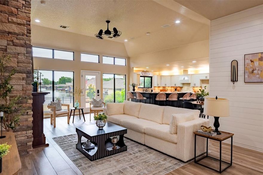 Stunning 5-bedroom, 3-bath home offering 3,716 sq. ft. in the highly sought-after Waters Edge neighborhood. Completely remodeled in 2022 with a beautifully designed second-story addition by an internationally known architect, this exceptional waterfront property combines luxury, comfort, and functionality. Situated on a premium canal lot, the home features expansive living-area windows showcasing breathtaking, unobstructed water views. The oversized water access provides extra maneuvering room, making it easy to back your boat out and return directly to your covered boat slip.
The beautiful chef’s kitchen is highlighted by exotic Patagonia granite and premium appliances, including a Fisher & Paykel propane range and dishwasher. Thoughtfully designed for both entertaining and everyday living, the home is filled with natural light, modern finishes, and architectural character throughout.
Designed with both comfort and efficiency in mind, the home includes traditional 8-ton AC systems serving both floors, plus three strategically placed solar-powered mini-split units on the first floor. These units operate on solar energy during the day and use stored solar power at night, allowing you to stay comfortable while significantly reducing electricity costs. The solar system is fully owned by the current owners and will convey with the property.
Conveniently located near restaurants, shopping, theaters, and just a few miles from the historic square, this home offers the perfect blend of peaceful waterfront living and easy access to town amenities.
A truly unique feature is the built-in safe room located within the utility room, constructed with cement walls and an 18-inch cap for added security and peace of mind during frequent tornado warnings—or worse.
Seller offers CLOSING COST ASSISTANCE WITH ACCEPTABLE OFFERS!
All information is deemed reliable but not guaranteed. Buyer to verify all information.