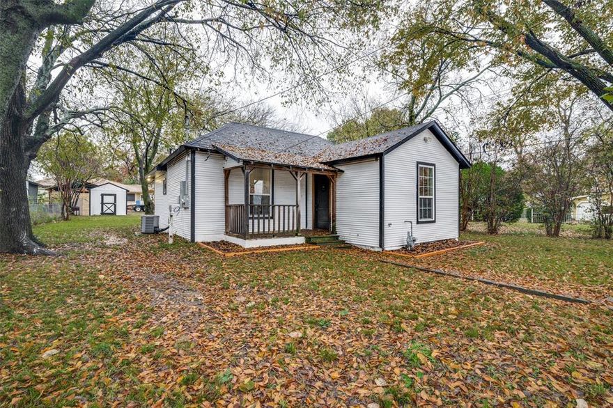 A Downtown Historical District house in the heart of Wylie, built in 1940, features two bedrooms and two full baths. The owners have remodeled everything in recent years, adding new insulation, a roof, and an HVAC system. Most original hardwood floors remain. The master bedroom is spacious, fitting a full set of furniture, while the second bedroom is ideal for a small child or a home office. The kitchen features high cabinets, an island, new appliances, including a gas stove, and granite countertops. Both bathrooms have updated fixtures. The home is within walking distance of downtown Wylie. The backyard offers a storage shed and space for all your vehicles.