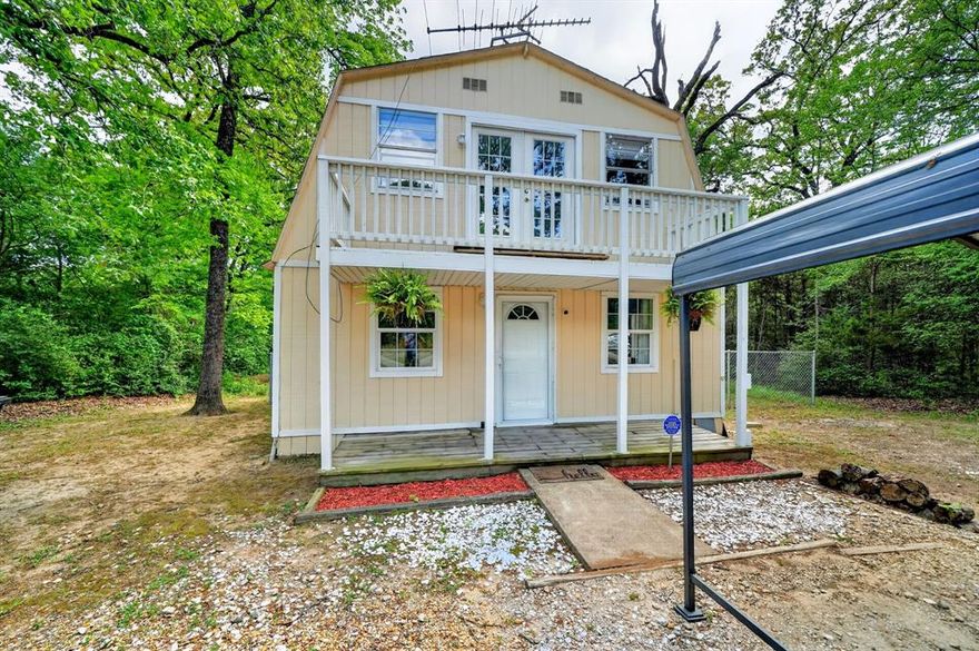 Tucked among mature trees, this charming 3-bedroom, 2-bath home offers the perfect lake-area escape at an affordable price. With its unique cabin-style design, inviting front porch, and elevated balcony, this home is full of character and ready for weekend getaways or full-time living. Inside, you’ll find updated flooring and fresh paint, making it move-in ready and easy to enjoy from day one. The tree-filled lot provides natural privacy, while the fenced backyard offers space to relax, entertain, or unwind after a day on the water. Located in a lake community with access to a boat ramp and playground, you can enjoy all the perks of lake living—without the waterfront price tag. Whether you’re looking for a weekend retreat, investment property, or budget-friendly home near the lake, this one is a must-see.