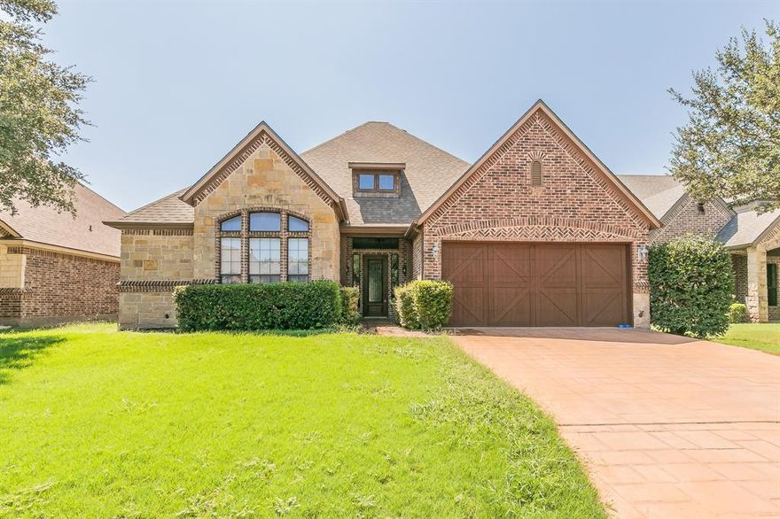 Beautiful Aledo home featuring a raised-ceiling entry, charming faux-finished walls, and a lovely kitchen with granite countertops, a large center island, and stainless steel appliances. Enjoy decorative lighting, vaulted ceilings, spacious walk-in closets, a jetted tub, ceramic tile, and so much more. Conveniently located near Ranch House Rd and I-20 with easy access to Fort Worth and Lockheed. Zoned for Aledo ISD. This home includes numerous upgrades and extras, plus a cozy backyard with a covered patio perfect for entertaining.