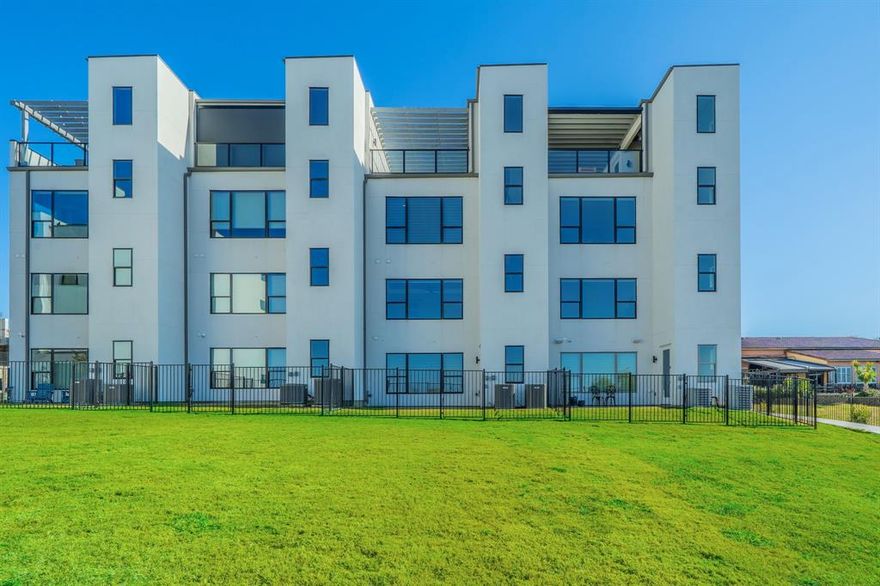 Stunning 4-story contemporary townhome with direct Lake Lewisville views, elevator access to all levels, and a show-stopping rooftop deck! This light-filled home features an open-concept layout with expansive windows, rich wood flooring, and a modern chef’s kitchen complete with quartz countertops, an oversized island, and premium appliances. Each spacious bedroom includes an ensuite bath and walk-in closet, while the luxurious primary suite showcases a spa-like bath with custom built-ins, a standalone soaking tub, dual sinks, and an oversized walk-in closet. The open family room offers large lake-facing windows and a cozy fireplace for year-round enjoyment.

The rooftop level is an entertainer’s dream—featuring a built-in outdoor kitchen and panoramic lake vistas and fireplace. Additional highlights include a 2-car garage, community pool, nearby walking trails, and a prime location minutes from Grandscape, The Star, PGA facilities, and major highways.

Located within a boutique 33-unit community with stunning lake views, this rare offering provides low-maintenance luxury living just moments from world-class dining, entertainment, and shopping—including The Star, Legacy West, Grandscape, Nebraska Furniture Mart, and PGA Headquarters. 

Buyer and Buyer's agent to verify all information including schools, sqare footage and all information listed.