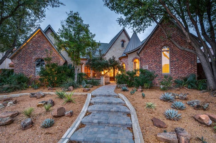 This stunning one-story custom home in guard gated Starwood seamlessly combines comfort and elegance, featuring exquisite interiors and a breathtaking private backyard. The outdoor living area is perfect for entertaining, complete with a fireplace and a built-in grill. The outdoor space showcases a sparkling pool, spa, and waterfall, all surrounded by lush landscaping. The expansive kitchen, equipped with a Viking stove, double ovens, large island and two Samsung dishwashers, opens to a cozy family room adorned with wood beams and vaulted ceilings. Additional highlights include a formal study, a media room, and a luxurious primary suite with cozy fireplace, and the completely remodeled primary bath that boasts radiant heated floors for ultimate comfort. Three additional bedrooms with ensuite bath. Numerous updates throughout make this the perfect home. Close to DNT, the Star, shopping and dining