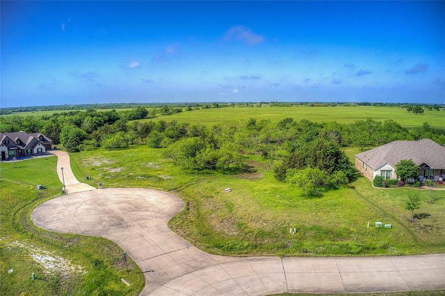 Beautiful 2+ acre lot on a quiet cul-de-sac with an unbelievable backdrop for amazing sunsets and beautiful mornings and evenings.  Build your dream home using your preferred builder nestled in this pristine neighborhood with may lakes stocked with large fish, playgrounds, parks, walking areas, greenbelts, gazebos and so much more.