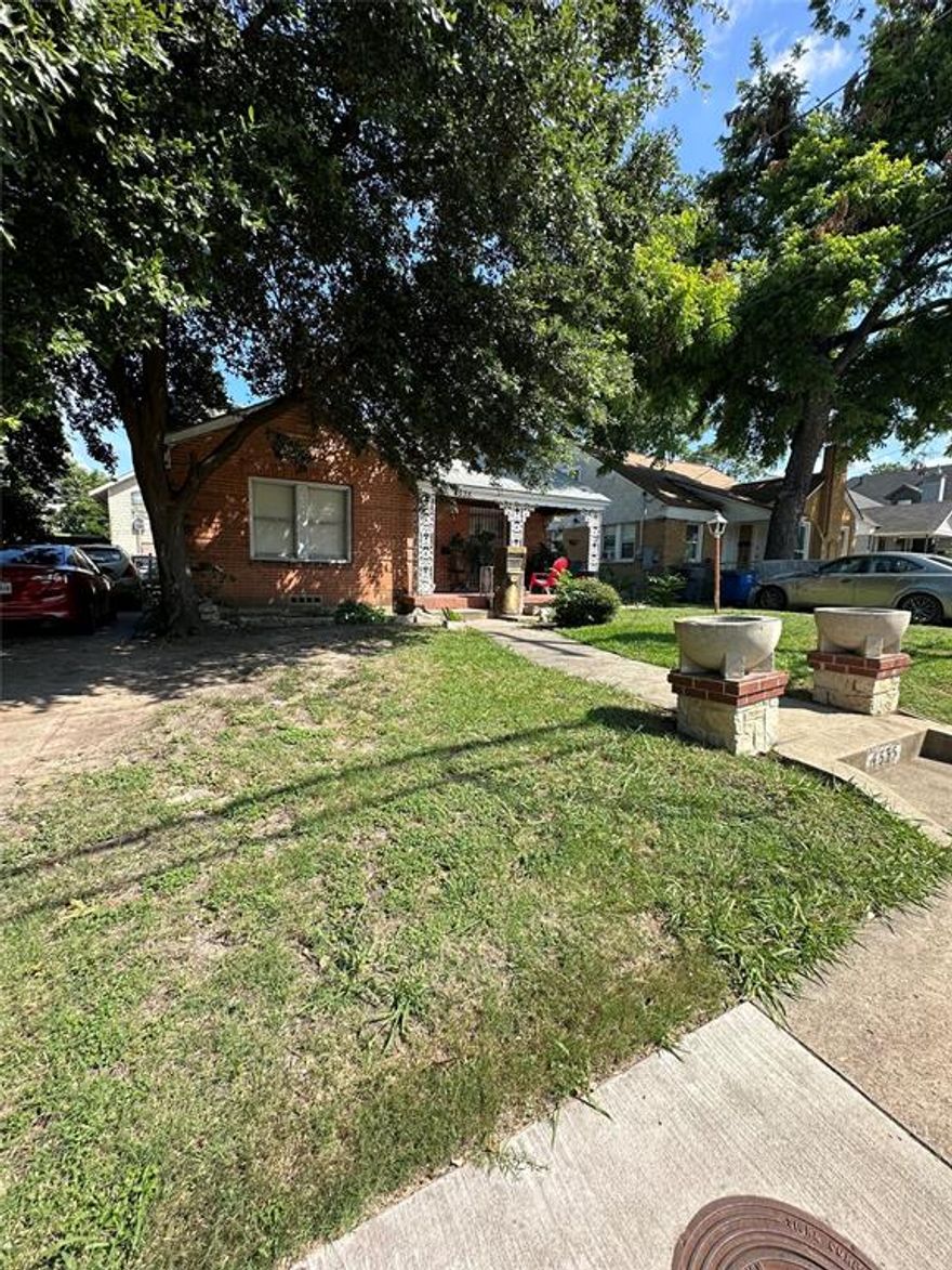 This property is located just minutes from downtown Dallas. The area is developing in different ways, such as new construction or renovating nearby. This brick home is being sold for land value.