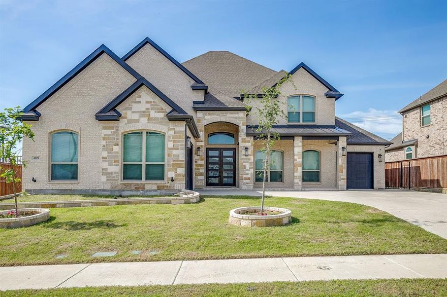 Nestled in a prime location just steps from the serene shores of Eagle Mountain Lake, this stunning traditional-style home offers an impressive +- 4,650 square feet of luxurious living space. Boasting 5 spacious bedrooms and 4 well-appointed bathrooms, this residence is designed to accommodate both comfort and elegance. The primary suite, conveniently located on the first floor, features a generous walk-in closet and provides a private retreat for relaxation. Upstairs, you'll find oversized bedrooms that offer ample space for family or guests, along with a dedicated media room perfect for movie nights or entertaining. The heart of the home is complemented by a covered veranda, ideal for outdoor gatherings or enjoying peaceful evenings. With its proximity to Eagle Mountain Lake, this property offers a lifestyle of tranquility and recreation. Whether you're hosting or unwinding, this home combines thoughtful design with exceptional features to create the perfect haven.