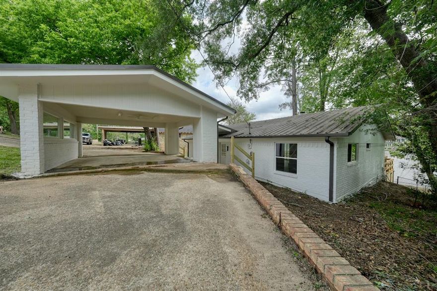 Completely reimagined and beautifully renovated, this stunning waterfront retreat offers the perfect blend of modern updates and relaxed lake living in the sought-after gated community of Hideaway. Ideally positioned on the fishing lake, this 3-bedroom, 2-bath home captures peaceful water views and invites you to enjoy every season from the comfort of home.

Inside, you’ll discover a fresh, move-in-ready interior with thoughtful renovations throughout. Updates include new windows that bring in abundant natural light, creating bright and inviting living spaces while showcasing the tranquil surroundings. The redesigned kitchen offers style and function with updated appliances, ample cabinetry, and a layout that flows seamlessly into the main living and dining areas—ideal for everyday living or entertaining guests.

The primary suite provides a comfortable private retreat, while the additional bedrooms offer flexibility for guests, hobbies, or a home office. Both bathrooms have been refreshed to complement the home’s updated appeal.

Step outside to one of the property’s standout features—a huge deck designed for enjoying the waterfront lifestyle. Whether sipping morning coffee, hosting gatherings, grilling with friends, or simply relaxing while taking in the lake views, this expansive outdoor space adds incredible value and everyday enjoyment. The metal roof offers longevity and low maintenance.

This beautifully updated home offers the rare opportunity to enjoy modern comfort, outdoor living, and serene waterfront views all in one exceptional property. Come experience everything this Hideaway gem has to offer.