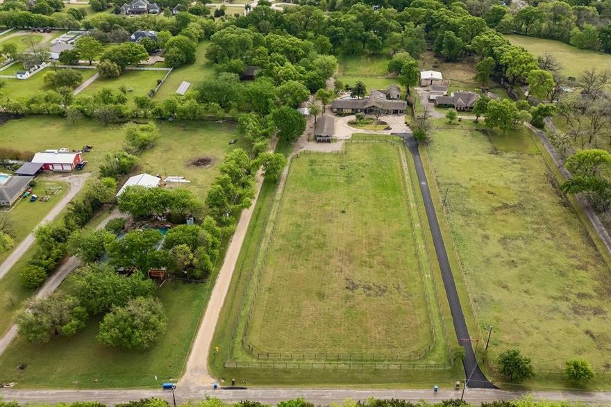 Opportunities like this don’t come around often. If you’ve been searching for a turnkey horse property with the infrastructure already in place, this is one you don’t want to miss. Set on beautifully maintained acreage in Parker, this home offers a rare mix of refined living and outdoor serenity perfect  for horse lovers or anyone craving space, privacy, and a true connection to the land.
 Designed around a hybrid Paddock Paradise and Equicentral system, the property easily accommodates multiple horses with 3 rotating pastures, a no mud track system and lush grazing fields  that have been soil-tested and maintained without chemicals, creating a natural, healthy environment for animals. The barn is equally impressive, offering 3 spacious stalls, a wash rack, feed and tack rooms and an airflow systems that keep horses cool in the Tx heat. A round pen, composting system, chicken coop, and she-shed make this property as practical as it is charming. 
Inside, the kitchen has been fully redesigned with Taj Mahal quartzite countertops,custom cabinetry, updated lighting,new appliances all anchored by stunning flagstone flooring throughout the living space.The primary suite w private outdoor accesss offers a serene retreat that capture the picturesque view of the vast open landscape.Beautifully updated with fresh lighting, flooring and oversized his and her closets.Add updates include a renovated utility space, dedicated office, an additional on suite bathroom and more. Outdoors, the property is fully fenced and cross-fenced, with  a solar-powered gated entrance, all enhanced by mature landscaping for easy maintenance.  What truly sets this property apart is its flexibility. Whether you envision horses, chickens, cattle, or simply wide-open space to enjoy, the infrastructure is already in place along with the option for equipment and farm essentials to convey. It’s a turnkey opportunity to step into a lifestyle that’s equal parts peaceful, functional, and beautiful.