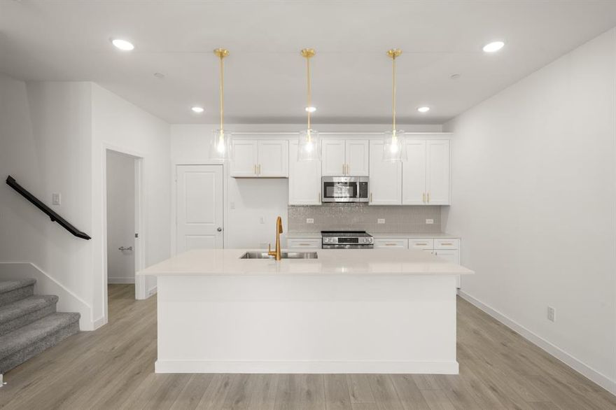 MLS# 21177111 - Built by Ashton Woods Homes - Ready Now! ~ Welcome to the Tulane, a thoughtfully designed two-story townhome in Watauga, TX. Designed with the Serene Collection, this home showcases muted earth tones and natural textures. Nine-foot ceilings enhance the openness, while a welcoming foyer, additional storage, and a two-car garage add practical convenience. The first floor is the heart of everyday living, featuring a bright, open-concept layout with a modern kitchen centered around a spacious island, shaker-style cabinetry, tile backsplash, and ample countertop space. The kitchen flows seamlessly into the dining and family areas, creating an inviting environment perfect for hosting or daily routines. Upstairs, two secondary bedrooms share a full bathroom, offering an ideal setup for guests, or a dedicated workspace. A versatile loft provides even more flexibility, whether as a media nook, play area, or home office. The private primary suite completes the second floor with a generous walk-in closet, double sink vanity, and a glass-enclosed walk-in shower. With its thoughtful use of space, elevated finishes, and flexible living areas, the Tulane delivers the modern comfort and refined style that define Ashton Woods living.