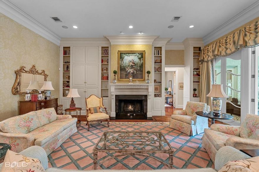 A timeless, elegant home situated in a private setting within the highly desirable Pierremont neighborhood, conveniently located in the heart of Shreveport. Welcome to 6421 Birnamwood, a truly exceptional one-story residence offering extraordinary craftsmanship and enduring quality throughout. Upon entering the foyer, you will be immediately impressed by soaring ceilings, exquisite marble and hardwood flooring, beautiful chandeliers, custom window treatments, generous room proportions, and abundant natural light.
The formal living room, features a fireplace with built-in bookcases soaring to the ceiling, and flows into a dining room comfortably seating twelve, complete with a separate service door to the kitchen. Just off the living room, a tucked-away study offers a tranquil view of a water feature. A spacious sunroom adds additional living space with access to the pool and patio area.
The gourmet kitchen features top of the line stainless steel appliances, a family dining table set within a floor to ceiling bay window, an enormous butcher block island, and a wet bar with glass cabinetry. The well designed floor plan offers three spacious ensuite bedrooms, including two primary suites, with sitting areas and custom walk in closets. 
Exterior amenities include a patio area, a generously sized swimming pool, a charming greenhouse, a two car enclosed garage, a circular dirveway, and a whole home generator.