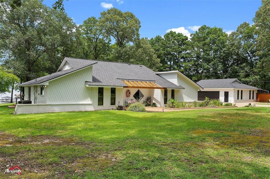 One of a kind opportunity to have almost 4 acres on wide open AMAZING views of Cypress Lake!  This home is recently remodeled with new wood floors in a large living with fireplace and cathedral ceiling, with updated kitchen featuring new granite, appliances, lighting and more!  The oversized bedrooms have all you've been looking for your fmailys comfort and enjoyment of this waterfront experience.  The owners suite is oversized and has a home gym to keep fit or office area to stay at home to enjoy the views!  The detached 3 car garage has hvac with half bath and drive through roll up on the rear size that leads to a covered area for all the things you need to store away!  RV cover and plug for your traveling needs or family!  Full boat dock for water toys and enjoyment!  Wander this gorgeous lot and just wow yourself with the gorgeous sunrises and sets while you enjoy a life of lake living!   Now just minutes away with the new parkway to 1-220, 20, the hosptials and all the conveniences! Come see this and bring us your offer today!