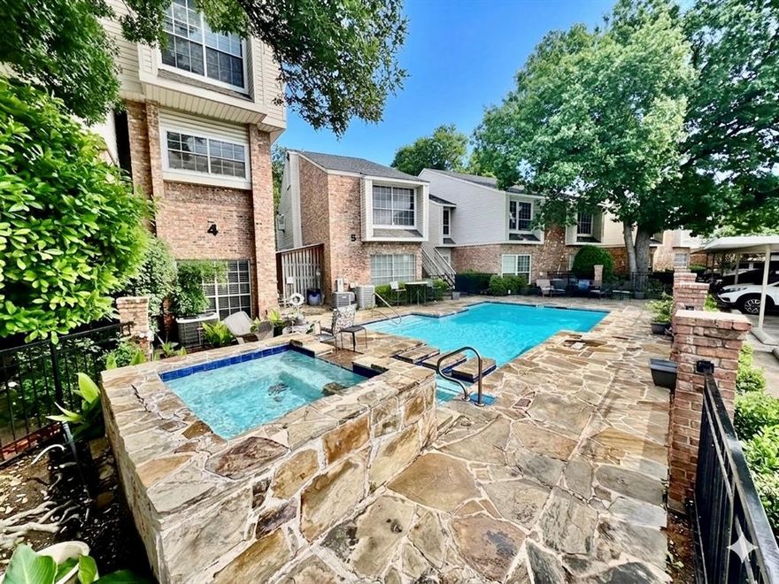 Modern ground floor, No-Stairs Lifestyle, convenience meets prime North Dallas location. This oversized floor-plan, and 882 sq. ft. updated condo is zoned for Brentfield Elementary in Richardson ISD and offers a seamless blend of style and function. The open-concept interior is anchored by a spacious living area featuring a wood-burning fireplace with a walnut mantel, a custom wet bar, and large windows that draw in natural light.

The updated kitchen is a standout, equipped with stainless steel appliances and a dual-zone wine fridge, perfect for entertaining. Step through french doors to a private patio overlooking a serene green space and flowing creek. First-floor primary and secondary bedroom offer a quiet retreat, while the modern bathroom features a tiled tub enclosure.

Key Features & Location: HVAC installed March 2022; contemporary lighting throughout. Assigned covered parking and amazing community pool with stone decking and grilling station. Minutes to UT Southwestern, Baylor Scott & White, and both convenient access to DFW and Love Field Airports. Near DART Rail Addison Station for easy commutes to Downtown Dallas.

Experience low-maintenance living with rapid access to the best of North Dallas and Richardson.