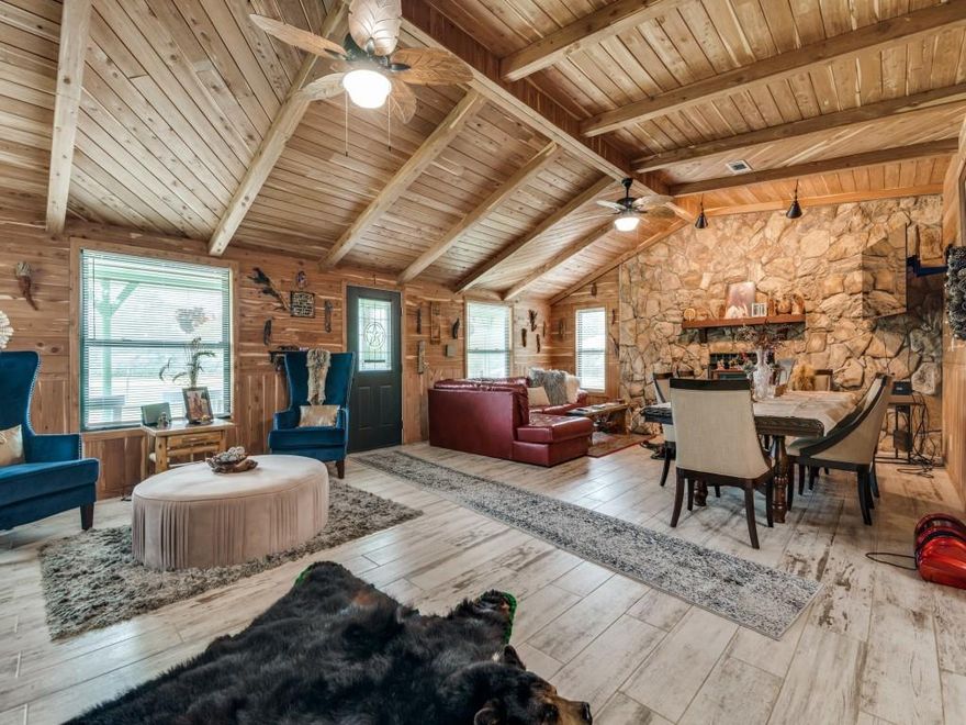 Beautiful completed remodeled house with separate guest house on secluded 10 acres with a pond and barn. House has been remodeled with new plumbing, electrical, windows, doors, fixtures, HVAC, etc. Elegant red cedar walls and ceiling are throughout the house along with wood look designer ceramic tile flooring. 3 big bedrooms each have their own baths. Office can also be a 4th bedroom. All bedrooms are split for privacy and baths have ceramic tile flooring and walls with granite vanities with decorative lighting. Kitchen has granite counters, farm sink, stainless steel appliances, ceramic tile wall, breakfast bar, pot filler, room for two refrigerators and lots of cabinets and counter space. Open dining area is large enough for a family size table for entertaining. Backyard has a beautiful covered deck with lighting. Above ground swimming pool with a large covered gazebo. Guest house has been remodeled with one bedroom, living area, kitchen and bath that would be a great mother in law house or to lease out for extra income. Property is fenced and crossed fenced with barns and storage buildings. This is a beautiful property!!