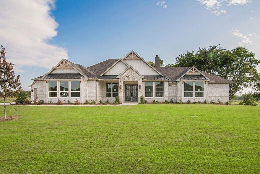 BROKER OPEN AND LUNCH FRIDAY NOVEMBER 7TH FROM 11-1
Don't miss this wonderful opportunity to own a newly constructed home on a 1.35-acre lot, featuring a beautiful tree line along the south property boundary. This stunning 3243 sq ft residence includes 4 bedrooms, 3.5 bathrooms, plus an office, and a game room. The front elevation showcases a charming country French design with stunning double steel front doors complemented by metal awnings. The light brick with dark cedar trim is a beautiful combination. 

Inside the home, the front entry has X-shaped beams in the tray ceiling. The office boasts a chevron-patterned tray ceiling.  The home features 5-inch plank wood flooring throughout all of the living areas, including the kitchen, study, hallways, and the primary bedroom. The main family room boasts a vaulted ceiling, a beautiful fireplace with shiplap to the ceiling, large inoperable picture windows. The family room is open to the spacious kitchen and dining area. The kitchen is equipped with 42-inch cabinets, a large quartz island, a custom hood, and plenty of counter space.  All of the counter tops in the house are quartz. 

The Primary Bedroom is separate from the secondary bedrooms. The luxurious ensuite bath has a huge walk through shower with double shower heads and floor to ceiling tiles. It also includes a 67 in free standing tub, dual vanities and ample closets 

Additionally, the property includes two oversized garages with full walk up attic stairs. This energy-efficient home is situated just outside city limits, offering a rural feel while still providing convenience to urban amenities. Easy access to US 75 and the new TI and chip plant in Sherman. Check out our feature sheet for more details about the house.  Scheduled completion late September.  Updated pictures will be available as construction progresses.  William Taylor Custom Homes has a stellar reputation for building quality custom homes in Grayson County.