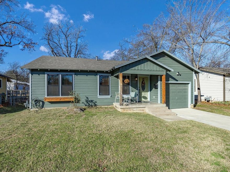 Nestled in the heart of Arlington, this inviting home blends vintage charm with thoughtful modern updates. Situated on a generously sized lot with mature trees, this move-in ready property offers curb appeal, comfort, and convenience all in one. Step inside to a light-filled living area with updated recessed lighting, fresh paint, and real hardwood flooring throughout. The floor plan flows easily from the cozy living space into the dedicated dining area and kitchen, making it ideal for everyday living or entertaining guests. The kitchen features rich wood cabinetry, a dual-basin stainless steel sink, granite counters, and a stylish tile backsplash. Just off the dining area, you'll find steps leading to a spacious bonus room—perfect for a second living space, home office, or guest retreat. The primary bedroom is a calming retreat with multiple windows for natural light and ample space for furnishings. Secondary bedrooms are well-sized with easy access to the updated full bath. Outside, the oversized backyard is fully fenced and offers endless potential—whether you envision a garden, play area, or future expansion. Enjoy morning coffee on the front porch or explore all that the area has to offer. Located near Arlington’s vibrant entertainment corridor, you’ll be minutes from Texas Live!, Globe Life Field, AT&T Stadium, Six Flags, UTA, and downtown dining and nightlife. Nature lovers will appreciate the proximity to Veterans Park, Lake Arlington, and nearby walking trails. Whether you're looking for your first home or a turnkey rental investment, 1400 Bennett Drive is a rare opportunity in a prime location.