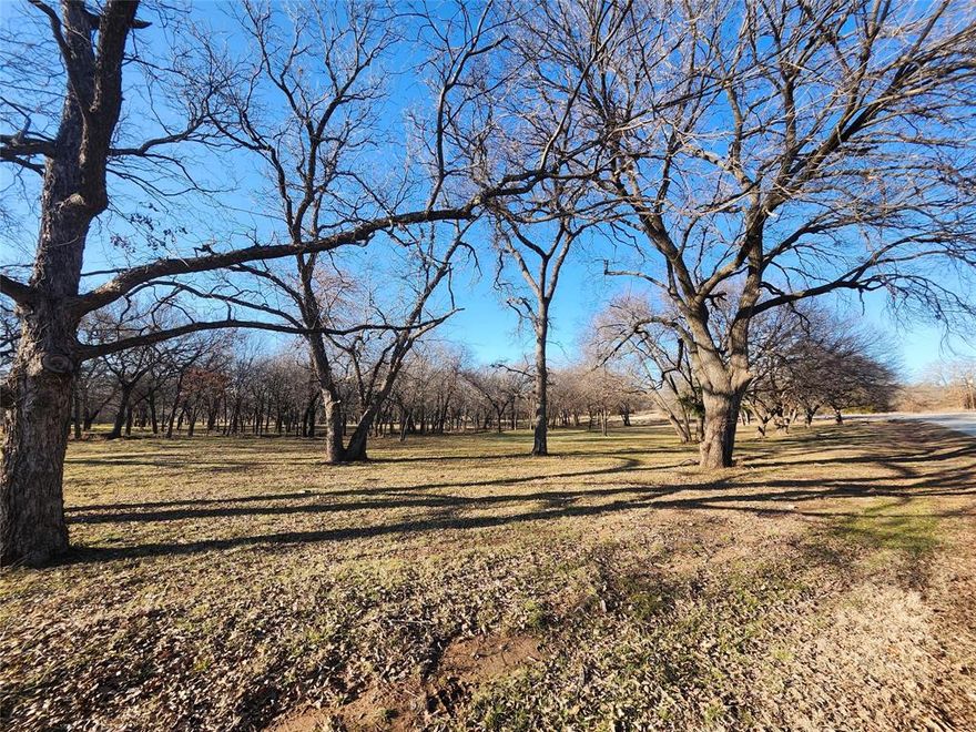 Beautiful build site in North Texas Hill Country! Property is 5 lots combined for a total of 1.37 acres across street from hole 6 and 7 on the golf course. Property has beautiful mature oak and pecan trees. There are 16 additional lots available that can be purchased bringing the acreage up to 7 acres. Lots are surrounded by the tranquility of nature as you will often see deer all around the property. Nocona Hills offers a 24-hour guarded gated community with access to two private lakes (one listed as top 5 Bass fishing in Texas)a community boat ramp and dock, as well as an 18-hole golf course with driving range, an airstrip, campgrounds with RV sites, and more. Utilities include co-op water and electric already at street. Fiber optic high speed internet is also available. Nearby surroundings include historic downtown Nocona, a winery, brewery and just a short drive to Saint Jo, Muenster and popular Casinos. Come see.  The Club house is under remodel along with the pool such an exciting new Update for the community.