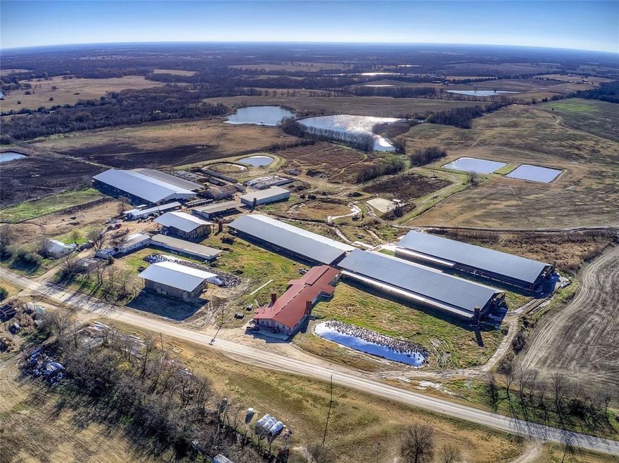 Fully operational Dairy Farm located 10 miles southeast of Paris, TX on 961.95 acres in Lamar County. Dairy is permitted for 2,000 milking head while currently milking 900. In addition to a Double-24 basement Parallel Parlor with two DeLaval 7,000 gallon milk tanks and Blue Diamond Rapid Exit this dairy features a Double-8 Herringbone fresh cow - hospital milking barn. Includes three freestall barns with a total capacity of 820 milk cows, a 132 dry cow freestall barn plus maternity barns, three weaning calf barns, a 60' x 360' loafing barn and a covered feed lane for bred and open heifers. Commodity barn has 8 concrete bays. Two hay barns, four concrete silage pits and more. New roofs!