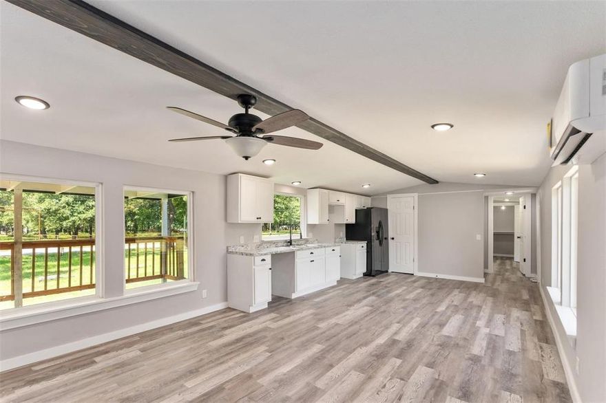 Great opportunity to own a remodeled single-wide home on 2 acres of land with endless potential. Great location walk to lake. This home has been totally updated, featuring a new metal roof, board-and-batten siding, insulation, windows, HVAC, front porch railing, electrical and plumbing systems, sheetrock, flooring, lighting, kitchen cabinets, and fully updated bathrooms. Refrigerator included.
Enjoy a fenced backyard area plus a large covered concrete patio—perfect for outdoor activities, pets will enjoy, great for relaxing evenings. Property includes city water and an aerobic septic system. Located in a highly rated school district and conveniently close to restaurants, shopping, and everyday amenities. Survey available in transaction documents. Cash or VA loan....