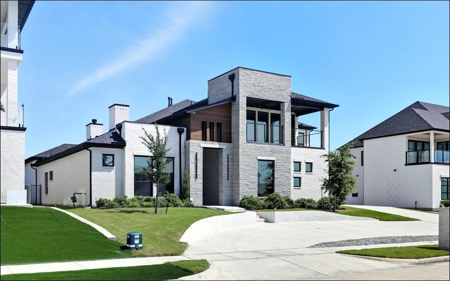 Luxury Lakeview Living in Heath Golf & Yacht Club! 4 Beds, 5 Baths, 4,435 Sq Ft  Built 2022  0.26 Acres  3-Car Garage
Welcome to this stunning Whittle & Johnson custom built lakeview home, ideally situated in the prestigious Heath Golf & Yacht Club community. With breathtaking views of Lake Ray Hubbard, this move-in-ready residence blends luxury, functionality, and exceptional design across 4,435 square feet of elegant living space.
Inside, you'll find 4 spacious bedrooms and 5 bathrooms, including two main-floor master suites, each with spa-inspired en-suite baths. The first floor features 3 bedrooms and 3.1 full baths, while the second floor offers an additional living area with a 4th bedroom, full bath, and gorgeous water views perfect for guests or multi-generational living.
The open-concept layout showcases a gourmet kitchen with a statement waterfall island, gas stove, double ovens, and upscale finishes throughout. The expansive primary suite includes a luxurious bath with soaking tub, oversized shower, and a custom walk-in closet.
Enjoy seamless indoor-outdoor living with a built-in outdoor BBQ ideal for entertaining or relaxing evenings as the sun sets over the lake. The 3-car garage provides ample space for vehicles and storage.
Set on a 0.26 acre lot, this home is part of a premier lakeside golf community offering world-class amenities: Private marina, Resort-style pool, Clubhouse with dining, Tennis & pickleball courts, Scenic walking trails, Championship golf course.
Located in a top rated school district, this rare offering combines upscale living, water views, and a vibrant community lifestyle.
Don’t miss this exceptional opportunity to own one of Heath’s finest lakeview homes!