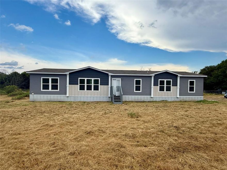 Priced more than $200,000 BELOW the recent appraisal—this 7.377-acre Cresson property delivers space, privacy, and a beautifully finished modern home without the price tag normally seen in Parker and Johnson County acreage.

Built in 2021, this Texas-size 2,220 sq ft Clayton home offers an exceptional layout rarely found in manufactured homes. Designed with comfort and quality in mind, the home features 4 bedrooms, 3 full baths, 2 living areas, and an open kitchen with island, granite countertops, and upgraded finishes throughout. From the moment you enter, the home feels warm, inviting, and surprisingly upscale.

The acreage offers a mix of landscaped space around the home, a peaceful pond, and additional land extending toward the back—perfect for animals, gardening, equipment storage, or creating your own homestead setup. The long private approach provides added seclusion, distance from the highway, and room to customize your entry exactly the way you want.

A valuable bonus: the property includes an additional 0.453-acre, 30-ft access easement, offering flexibility for future use, expansion, or improved access options.

Located just minutes from Cresson amenities and an easy commute to Granbury, Weatherford, and Fort Worth, this property balances rural quiet with everyday convenience. Whether you’re looking for a peaceful retreat, room for livestock, or an affordable acreage property in one of the fastest-growing corridors in North Texas, this one delivers outstanding value and potential.