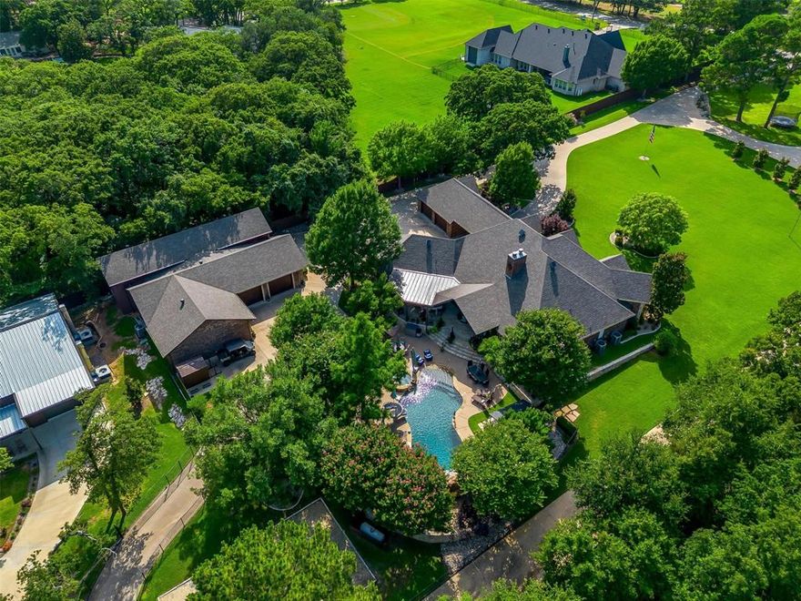 Extraordinary Multigenerational Estate or Private Event Venue on 4.49 Acres – Two Luxury Residences, Resort-Style Amenities, and Premier Accessory Buildings.  Discover a one-of-a-kind manor featuring two luxury homes, exceptional outdoor living spaces, and first-class accessory buildings – located on a private get away with magnificent landscaping with a dual gated entry and paved access throughout.  Amenities include: 8’ tall privacy fencing on side, sand beach volleyball court, and shooting range with backstop and interior storage container. Luxury Accessory Building 1: RV garage with roll-up door, three-bay car garage, gym, sauna, safe room, conditioned office with bathroom, and climate-controlled space throughout.  Luxury Accessory Building 2: Classic car showroom with commercial-grade HVAC, large roll-up door, mobile privacy walls, covered porch, three glass roll-up bays, and covered back awning with batting cage. This is a rare opportunity to own a fully developed multigenerational compound with resort-style amenities, endless entertainment spaces, and extraordinary storage for cars, RVs, and toys – all within a private, gated setting.  The property offers expansive indoor and outdoor spaces that can accommodate large groups while still maintaining an intimate and inviting atmosphere that could host everything from weddings and receptions to corporate gatherings, parties, and community events.  With plenty of room for customization and strong income potential, this property presents an outstanding opportunity for investors or operators looking to step into the thriving events industry.  Both 3208 & 3212 County Road 531 must be sold together.