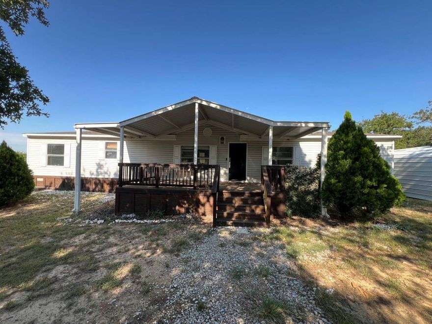 Three bedroom, 3 bath doublewide on 1 acre, treed lot.  Being sold as is.