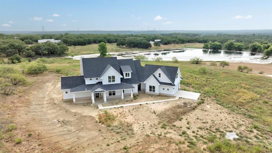 95 % completed NEW CONSTRUCTION !!! Embrace unparalleled elegance in this brand-new custom home on a sprawling 2-acre estate in the esteemed Silver Lakes Ranch community. This masterpiece offers an exquisite open floor plan bathed in natural light, centered around a cozy fireplace.

Escape to the luxurious master suite, your private retreat with a spa-inspired en suite bath featuring a separate soaking tub, dual vanities, and a walk-in closet. The practical layout includes a sophisticated utility room seamlessly connected to a mudroom off the garage.

The second floor hosts a spacious game room and two bedrooms connected by a stylish Jack and Jill bathroom.

Step outside to your personal sanctuary on the expansive covered back patio and enjoy serene views under the Texas sky.

This is an extraordinary opportunity to live your dream on prime Texas land. Enjoy exclusive community amenities: pool, lake, and clubhouse.

Move-in ready in just 3 weeks—just in time for the HOLIDAYS! Welcome to your fabulous new beginning in Silver Lakes Ranch.