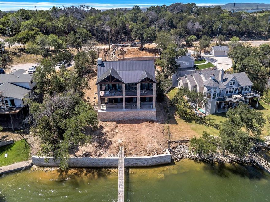 Exquisite New build on beautiful Possum Kingdom Lake. 5 bedroom, 5.5 bath with focus on entertaining and those breathtaking lake views. Imagine watching the sunrise and set from this amazing home.  Not one detail has been spared with impeccable workmanship and attention to detail. Easy walk to your private deep open water dock.  Opportunities like this do not come around often. Professional photos will be updated as home progresses to completion.