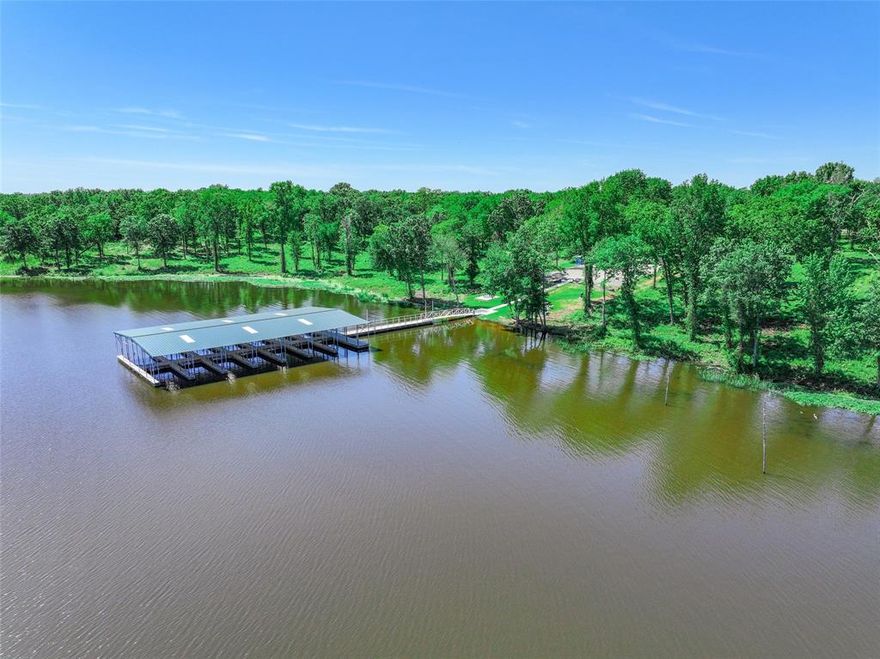 Welcome to luxurious Lake Fork living! Embrace your perfect retreat on this 1-acre property with an additional .48-acre leaseback from Sabine River Authority. This land is ready for your custom home – envision your private boathouse or pier. Surrounded by lush greenery, relish in the tranquility of a paved private road. Just 1.5 hours from Dallas and near Sulphur Springs, this peaceful oasis marries convenience with natural splendor. Benefit from existing asphalt streets, underground utilities, and the added security of a private gate. If you've been yearning for a lakeside lifestyle, don't miss out on this opportunity!