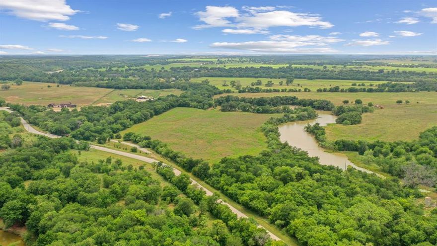 Hard to find 74 +-  AG-EXEMPT, Unrestricted acres with Brazos River creek frontage in Parker County. This property serves as the perfect blank canvas to build your dream home and host all your livestock and cattle. The property has a MASSIVE deep creek sourced through Rock Creek that runs through the center of the acreage and is beyond breathtaking. One livestock pond located in the back of the property.  There are numerous mature trees throughout the acreage and tons of active wildlife year-round. Plenty of turkey, deer and other wildlife.  This property has two access gates and road frontage to Goen, Bennett, and Rock Creek Road. Along Bennett Road, Goen Road and Rock Creek Road, there is a county water line that can be tapped into and electricity that is ready to be connected. This property located less than a minute drive from the Brazos River. A well and septic system can also be installed. The owner owns half of the old historic Bennett Bridge. This property has no restrictions so the opportunities are endless. There is an existing survey available upon request.